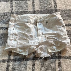 Distressed white shorts